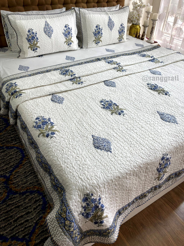 Charming Blue Floral Bedsheet Set with Matching Quilted Cover