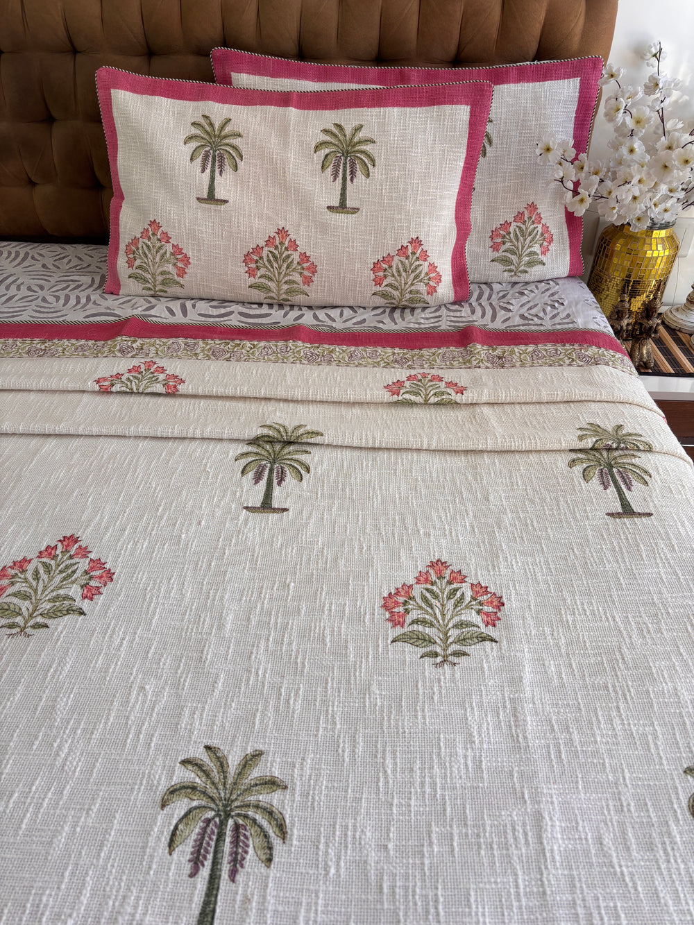 Gulmohar Grove hand block printed ivory jute cotton king size bedcover in home decor setting