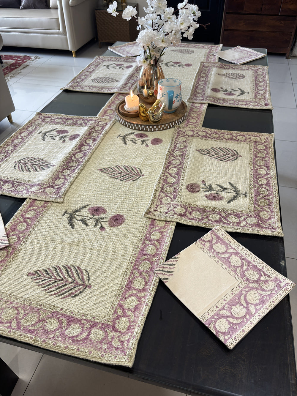 Lavender jute cotton table runner, mats and napkins in an elegant dining table setting