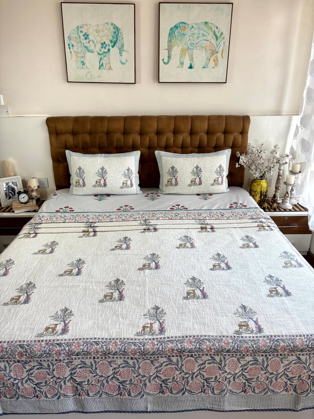 Mrigvana Reverie hand block printed king size jute cotton bedcover styled in an elegant modern bedroom.