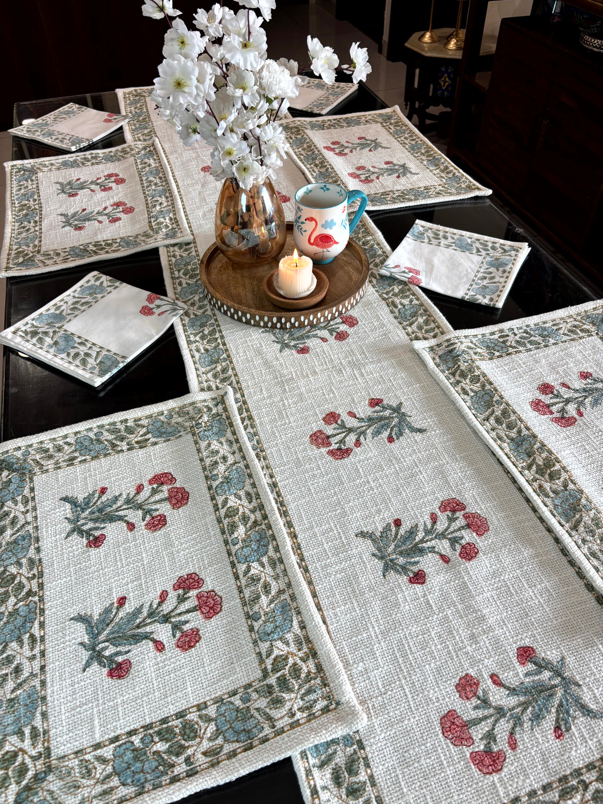Poppy peach hand block printed jute cotton table runner set styled on a dining table